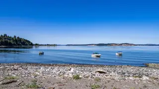 Beach and moored boats below Beachcomber RV Park