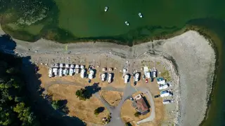 Overhead view of RV sites and beach at Beachcomber RV Park