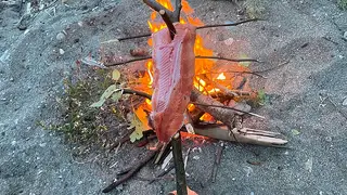 Small beach campfire on the sand at Beachcomber RV Park