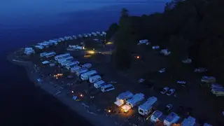 Evening lights from RV sites along the Beachcomber shoreline