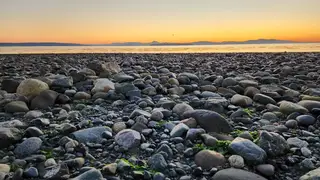 Rocky shoreline at sunset near Beachcomber RV Park