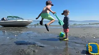 Children playing on the beach at Beachcomber RV Park